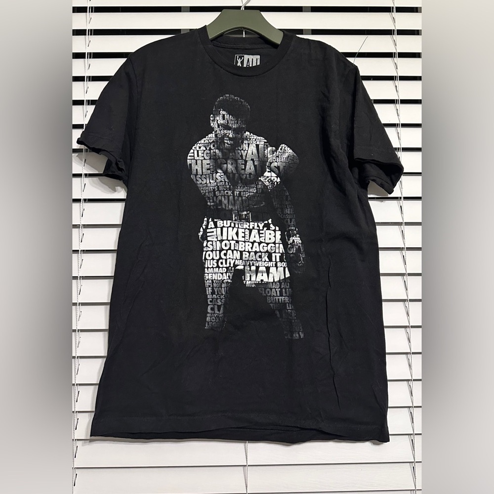 #2) Ali 100% T-Shirt Size Large